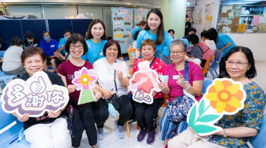 CLP Volunteer sharing energy saving tips with the elderly 