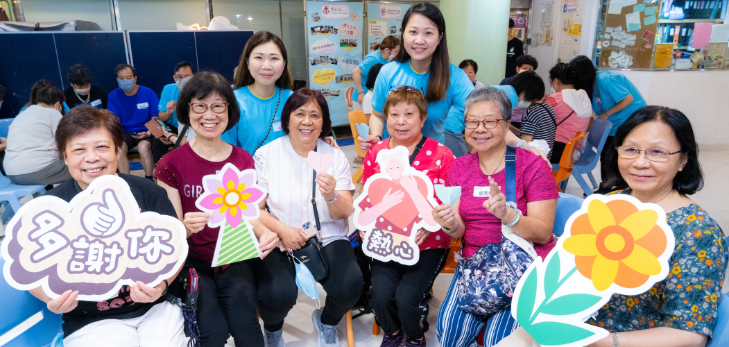 CLP Volunteer sharing energy saving tips with the elderly