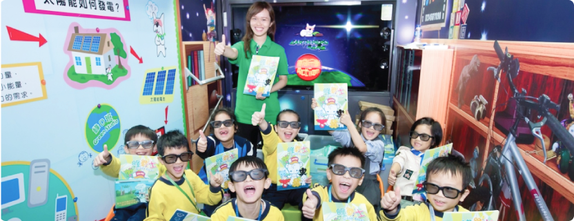 A group of students inside the Green Studio where they can play interactive games to learn green knowledge 